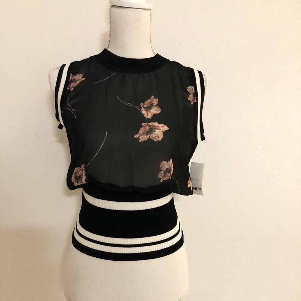 Sheer floral sleeveless mock neck top.